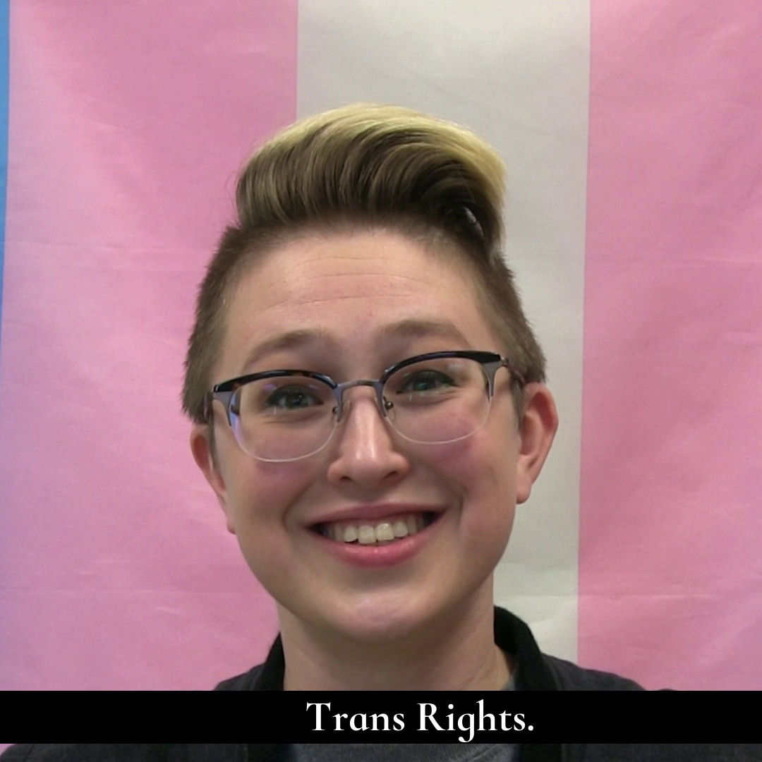 A person smiling at the camera. The caption says 'Trans Rights'